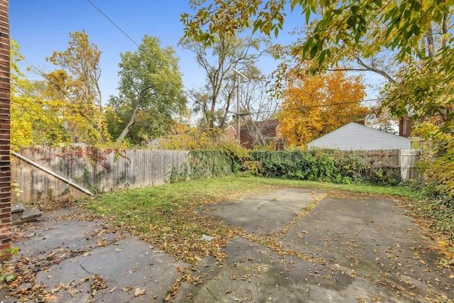 view of yard with a patio area and a fenced backyard