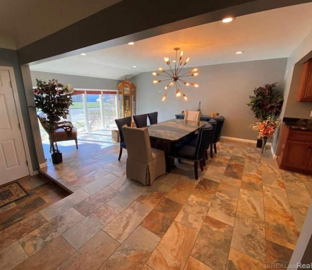 dining area with a notable chandelier, baseboards, stone tile flooring, and recessed lighting