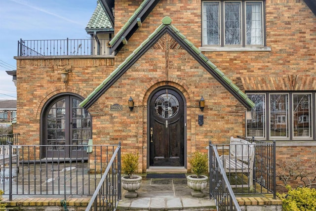 doorway to property with french doors and brick siding