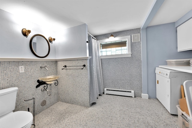 full bathroom featuring curtained shower, a baseboard radiator, toilet, visible vents, and tile walls