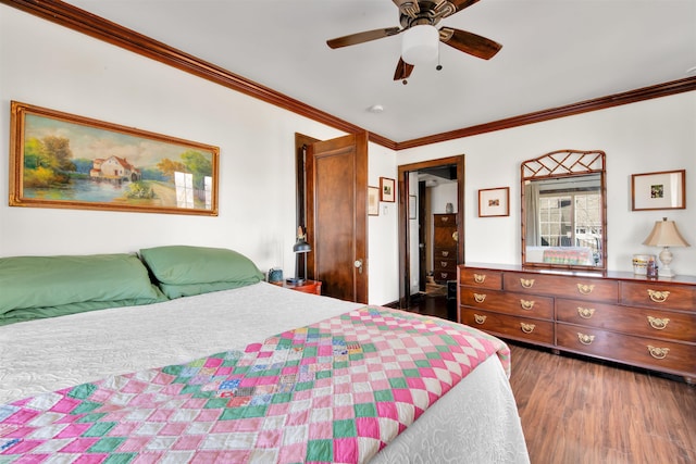 bedroom with a ceiling fan, crown molding, and wood finished floors