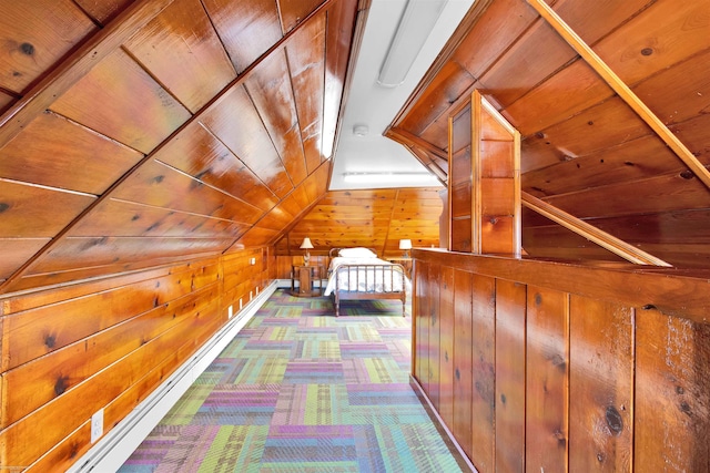 corridor with lofted ceiling, wood walls, carpet flooring, and wood ceiling