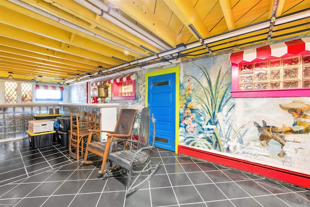 basement featuring tile patterned flooring