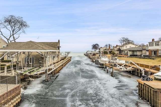 exterior space with a water view and a residential view