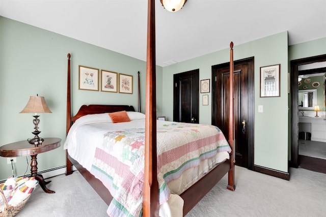 carpeted bedroom with a baseboard radiator