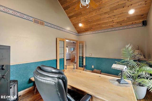 office with visible vents, wainscoting, wood finished floors, high vaulted ceiling, and wooden ceiling