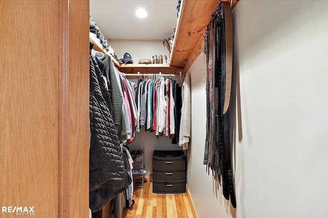 spacious closet with wood finished floors