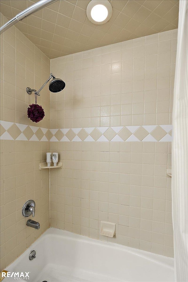 bathroom featuring shower / bath combination with curtain