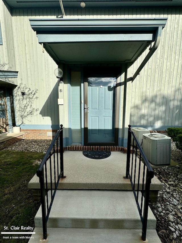 property entrance with central AC unit