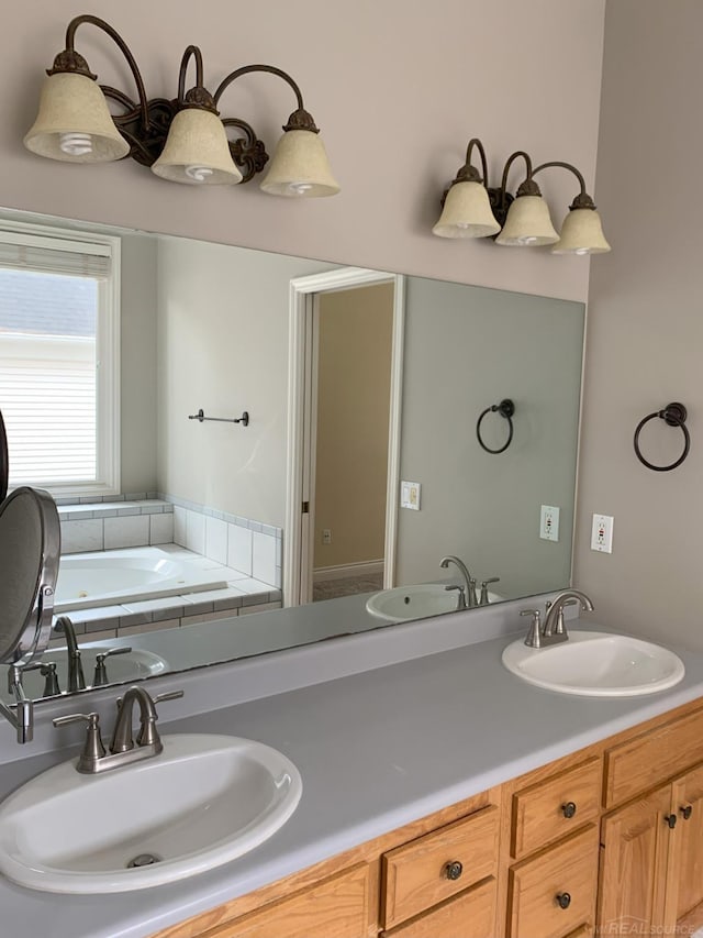 full bathroom with a sink and double vanity