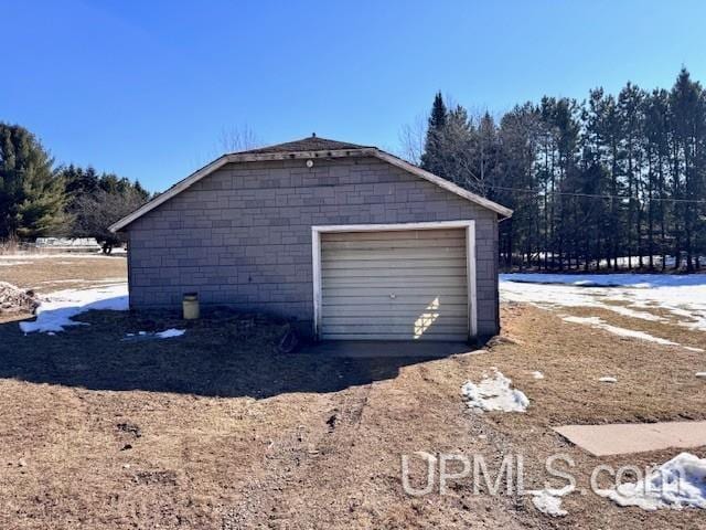 garage featuring driveway