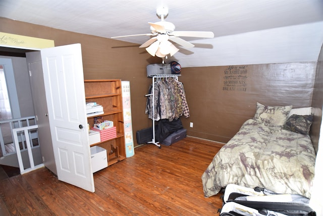 bedroom featuring a ceiling fan and wood finished floors