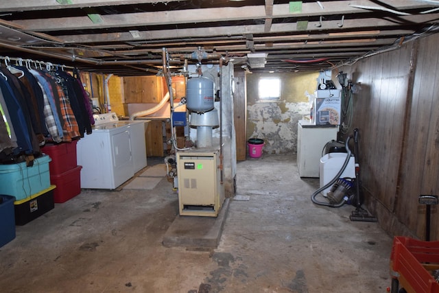 below grade area featuring washer and clothes dryer