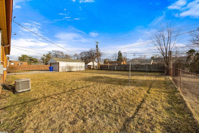 view of yard with a fenced backyard and central AC unit