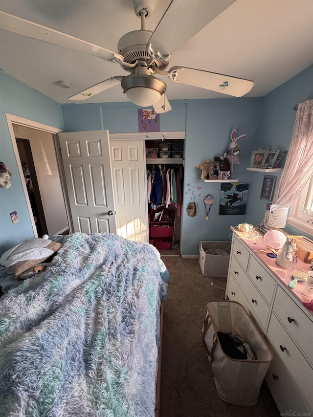 bedroom with ceiling fan, carpet floors, and a closet