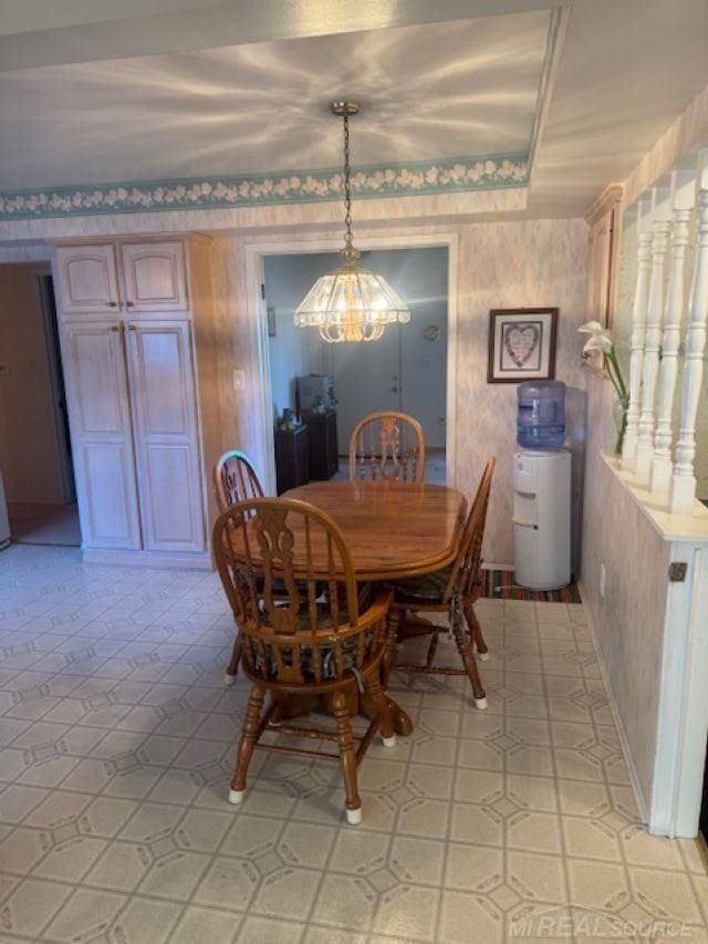 dining space with wallpapered walls