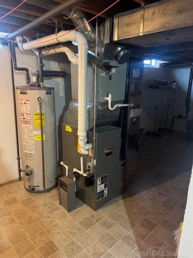 utility room with water heater and heating unit