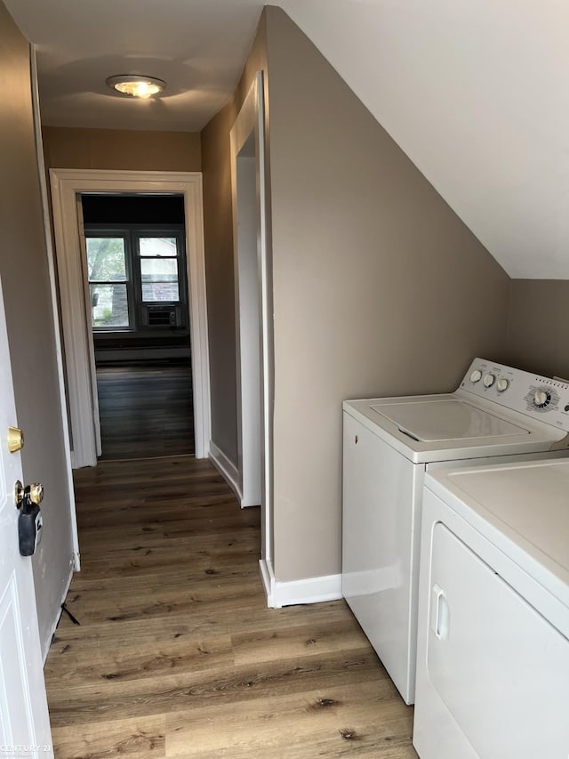 washroom with baseboards, laundry area, light wood finished floors, and washer and dryer