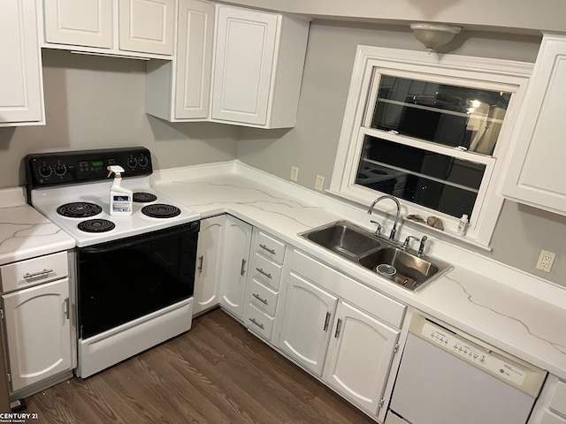 kitchen with dark wood-style flooring, electric range, white cabinets, white dishwasher, and a sink