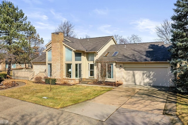 view of front of property featuring brick siding, a chimney, concrete driveway, a garage, and a front lawn