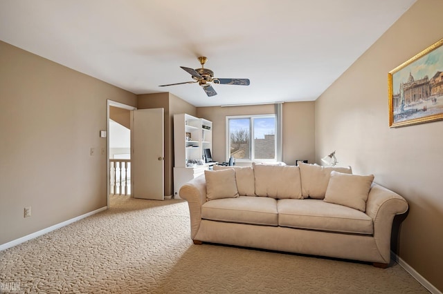 living room with a ceiling fan, carpet, and baseboards