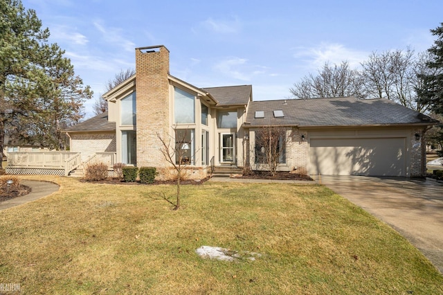 mid-century modern home with brick siding, a chimney, an attached garage, driveway, and a front lawn