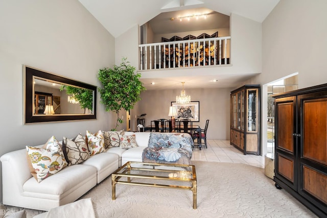 living room with high vaulted ceiling and light tile patterned flooring