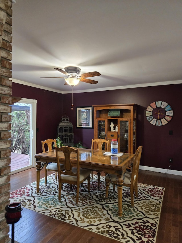 dining space with ornamental molding, a ceiling fan, hardwood / wood-style flooring, and baseboards