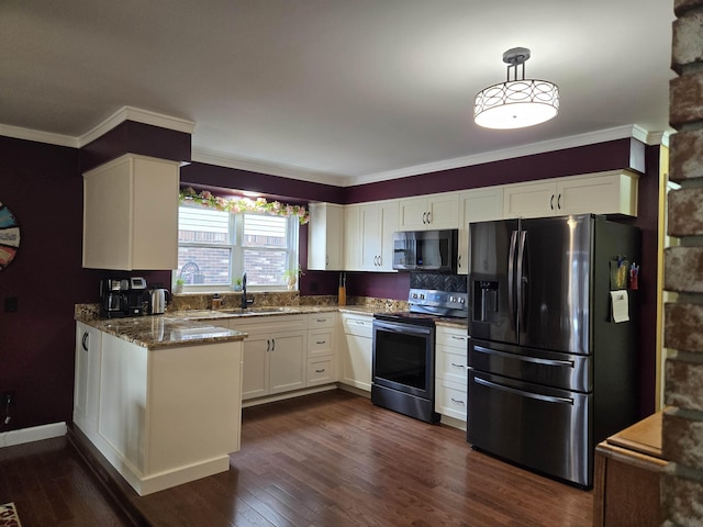 kitchen featuring stone counters, stainless steel appliances, dark wood-style flooring, a sink, and white cabinets