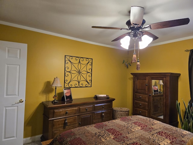 bedroom featuring ceiling fan and crown molding