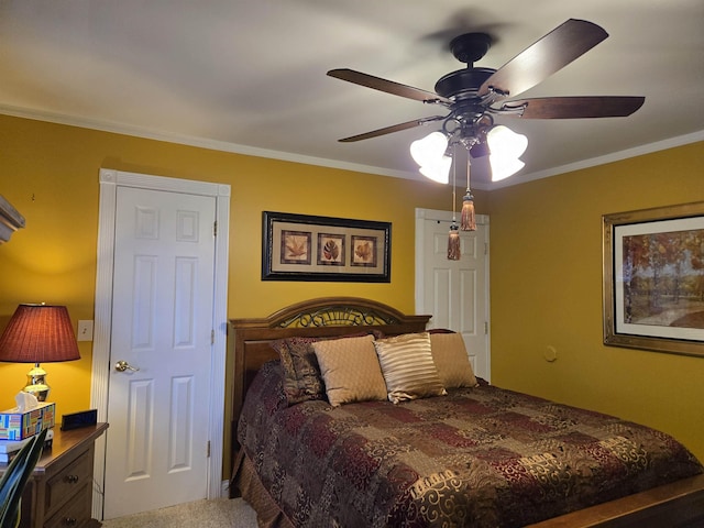 bedroom featuring carpet, ornamental molding, and ceiling fan