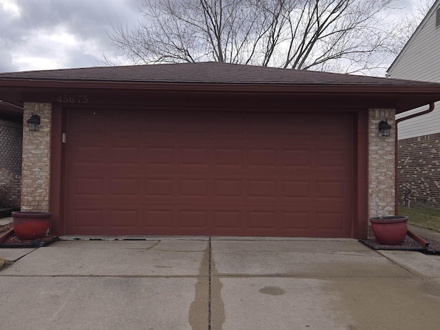 garage featuring driveway