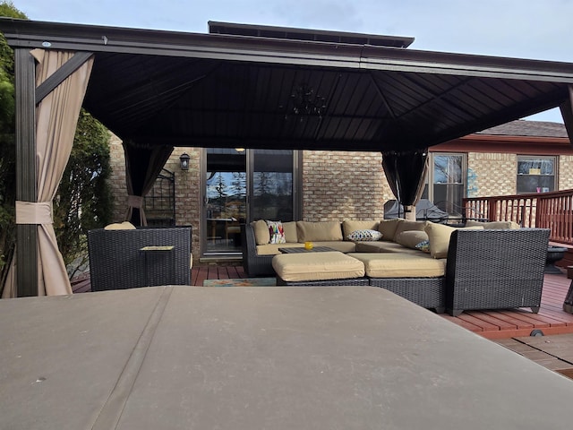 wooden deck with a gazebo and an outdoor living space