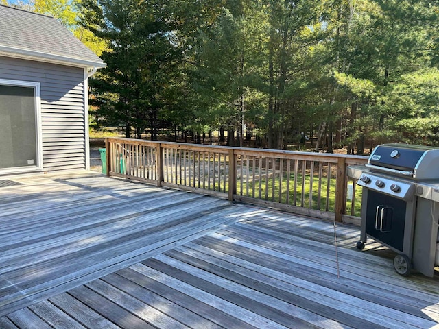 wooden terrace featuring a grill