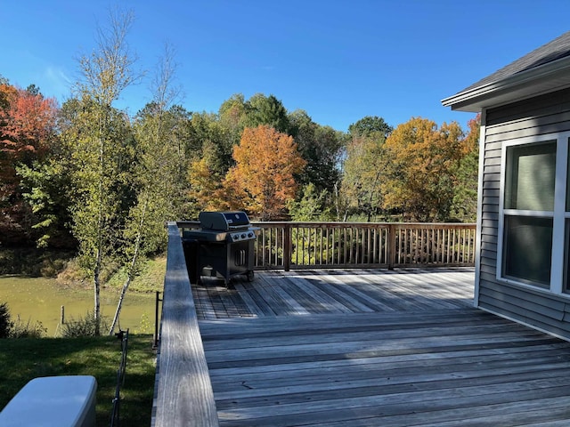 wooden terrace with area for grilling