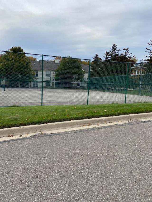 view of sport court featuring community basketball court and fence