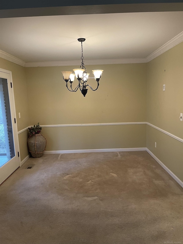 carpeted spare room with a chandelier, baseboards, and crown molding