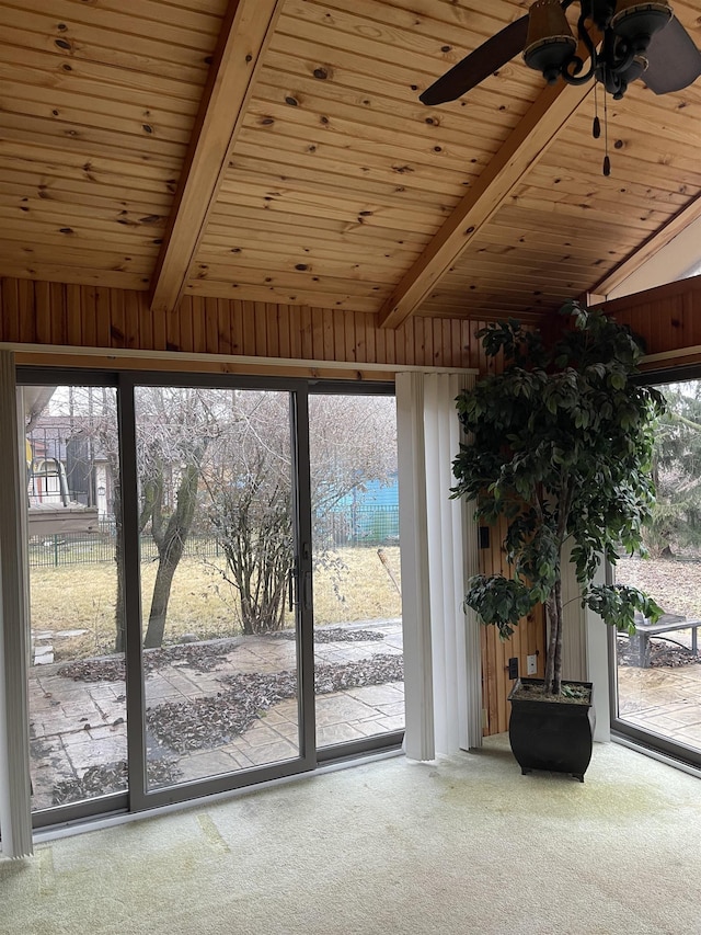 entryway with wooden ceiling, carpet flooring, and ceiling fan