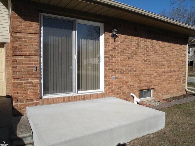 exterior space with brick siding