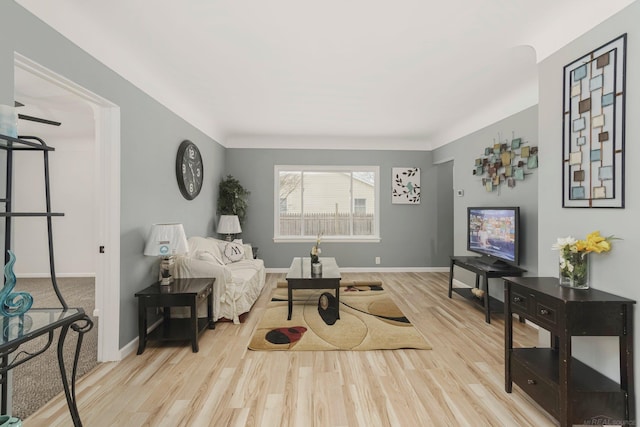 sitting room with wood finished floors and baseboards