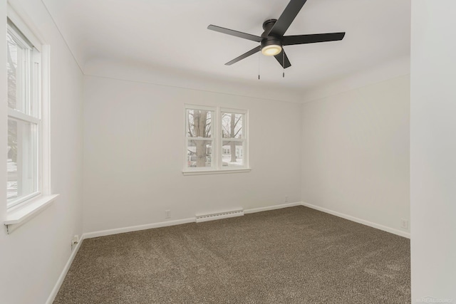 spare room featuring carpet, a baseboard radiator, a ceiling fan, and baseboards