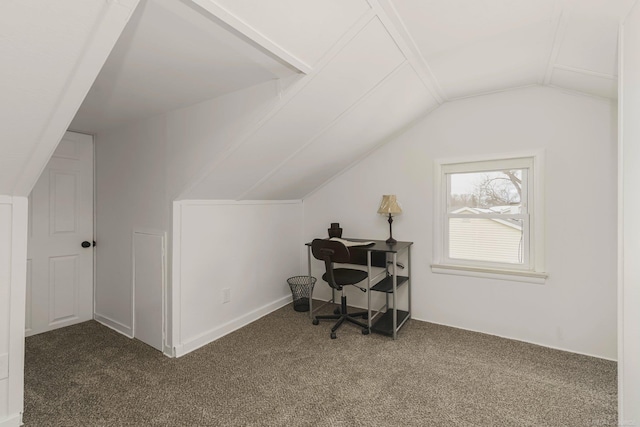 carpeted office with vaulted ceiling