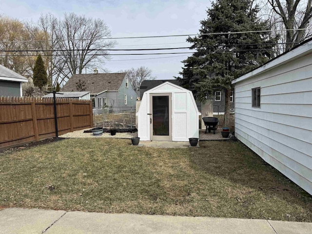 view of shed with fence