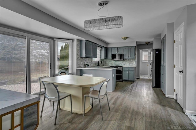 dining area with dark wood finished floors and baseboards