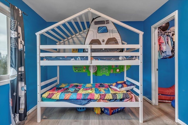 bedroom featuring wood finished floors