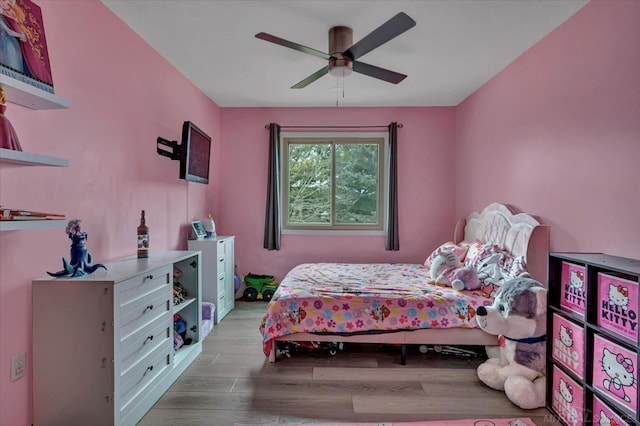 bedroom featuring ceiling fan and wood finished floors