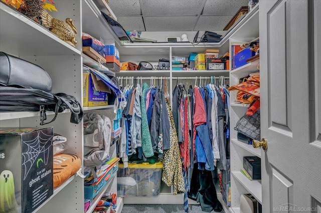 walk in closet with a paneled ceiling