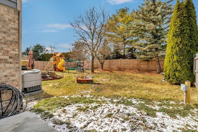 view of yard featuring a fenced backyard and a playground