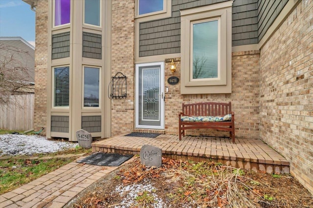 property entrance with brick siding