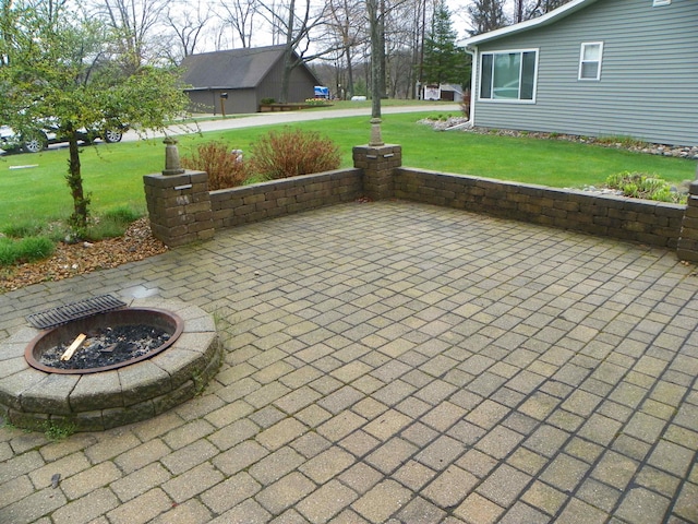 view of patio / terrace with an outdoor fire pit